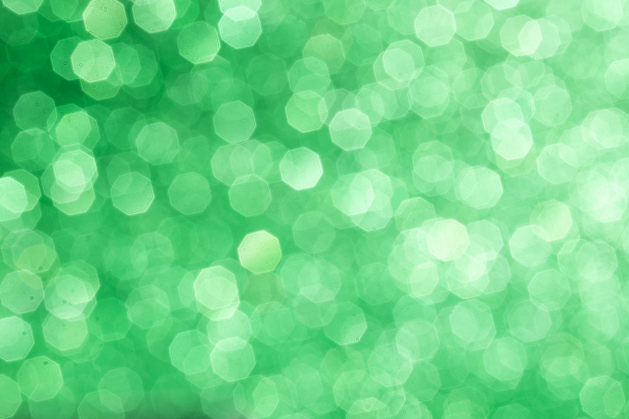 Green glittering background for design and free space.